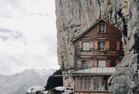 Off-The-Beaten-Path Destinations - Brown Wooden House on Edge of Cliff