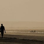 Coastal Walks - Silhouette Man and Woman Walking Near Sea