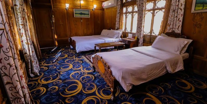 Luxury Hostels - Two Double Beds in the Room with Blue Carpet and Wooden Walls