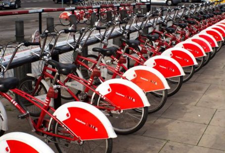 Car Rental Deals - Parked Red and White Bicycles